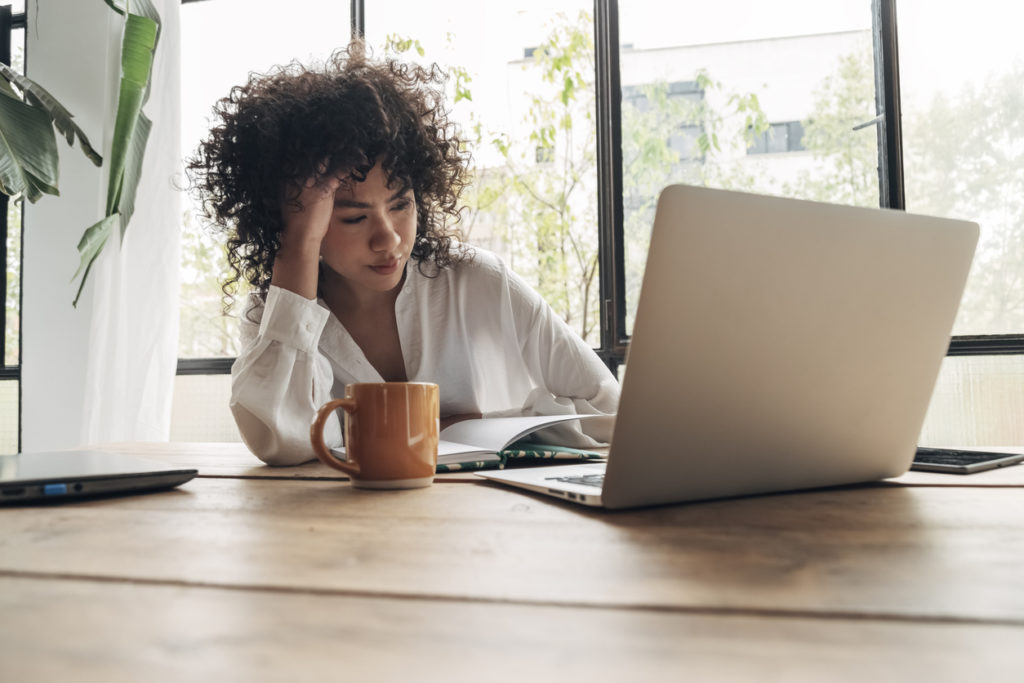 woman frustrated while learning new payment solutions software technology