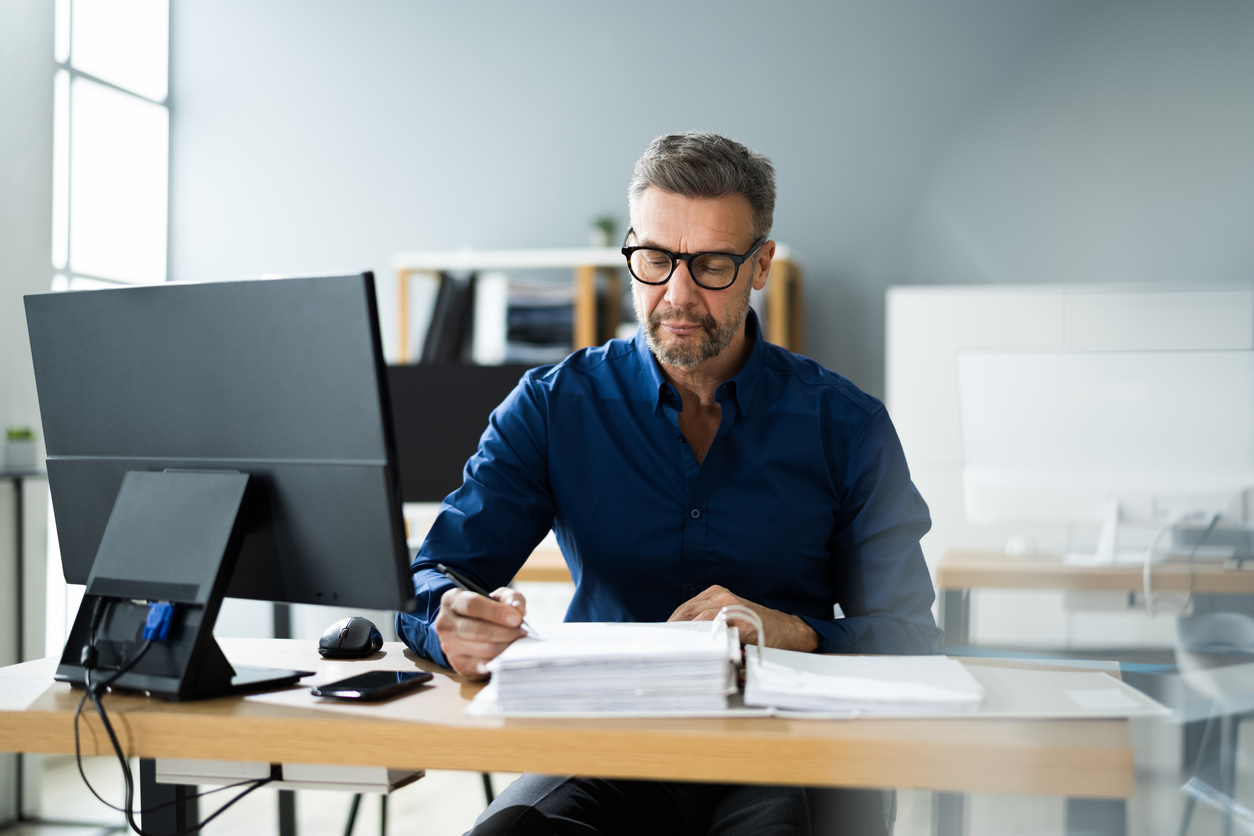 Man doing manual payment reconciliation