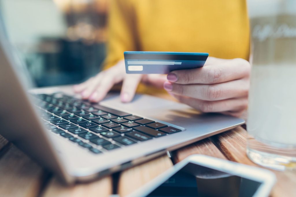 woman making electronic payment with credit card