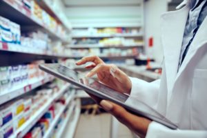 pharmacist using tablet
